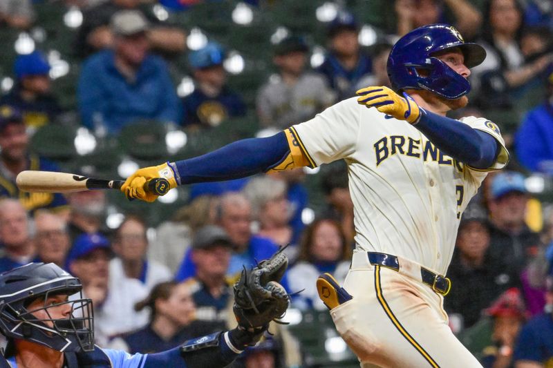 Apr 30, 2024; Milwaukee, Wisconsin, USA;  Milwaukee Brewers second baseman Brice Turang (2) hits a double to drive in two runs in the seventh inning against the Tampa Bay Rays at American Family Field. Mandatory Credit: Benny Sieu-USA TODAY Sports