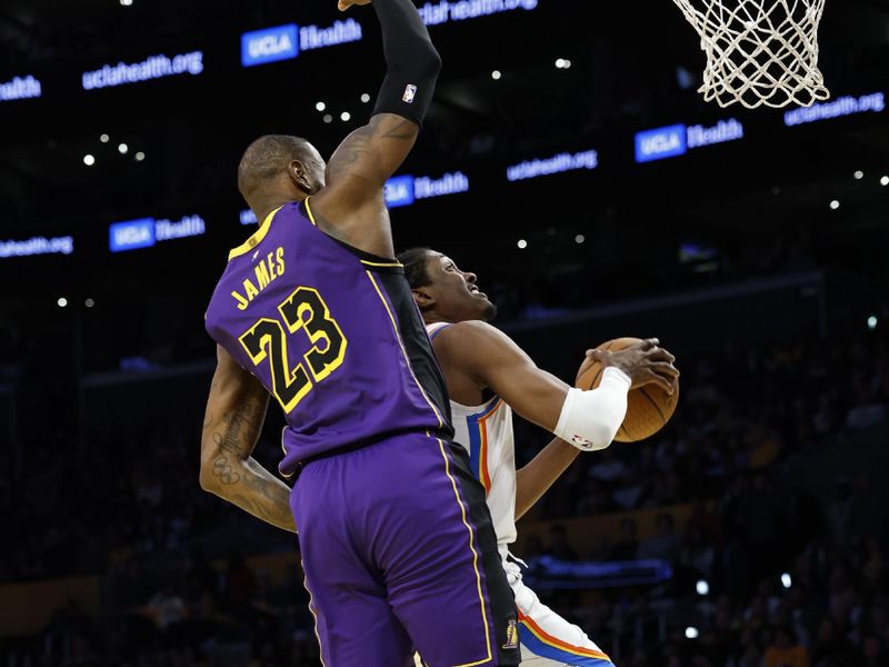 LOS ANGELES, CALIFORNIA - NOVEMBER 29: Jalen Williams #8 of the Oklahoma City Thunder shoots the ball against LeBron James #23 of the Los Angeles Lakers during the fourth quarter of the Emirates NBA Cup at Crypto.com Arena on November 29, 2024 in Los Angeles, California. NOTE TO USER: User expressly acknowledges and agrees that, by downloading and or using this photograph, User is consenting to the terms and conditions of the Getty Images License Agreement. (Photo by Ronald Martinez/Getty Images)