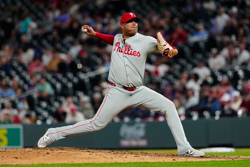 May 21, 2025; Denver, Colorado, USA; Philadelphia Phillies relief pitcher Carlos Hernandez (35) delivers a pitch in the ninth inning against the Colorado Rockies at Coors Field. Mandatory Credit: Ron Chenoy-Imagn Images