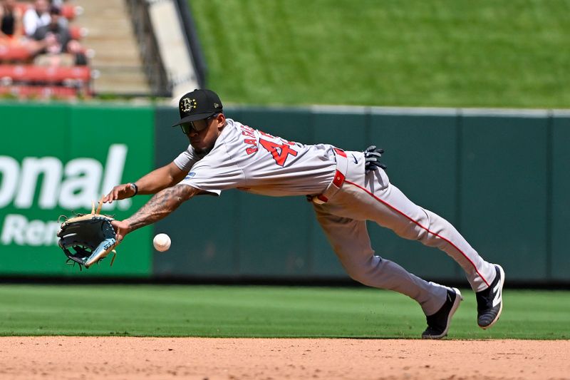 May 19, 2024; St. Louis, Missouri, USA;  Boston Red Sox center fielder Ceddanne Rafaela (43) dives for a ground ball hit by St. Louis Cardinals first baseman Paul Goldschmidt (not pictured) during the eighth inning at Busch Stadium. Mandatory Credit: Jeff Curry-USA TODAY Sports