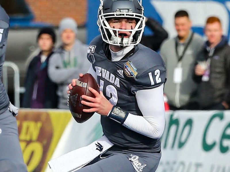 Jan 3, 2020; Boise, Idaho, USA; Nevada Wolf Pack quarterback Carson Strong (12) drops back to pass during the first half of the Famous Idaho Potato Bowl against the Ohio Bobcats  at Albertsons Stadium. Mandatory Credit: Brian Losness-USA TODAY Sports

