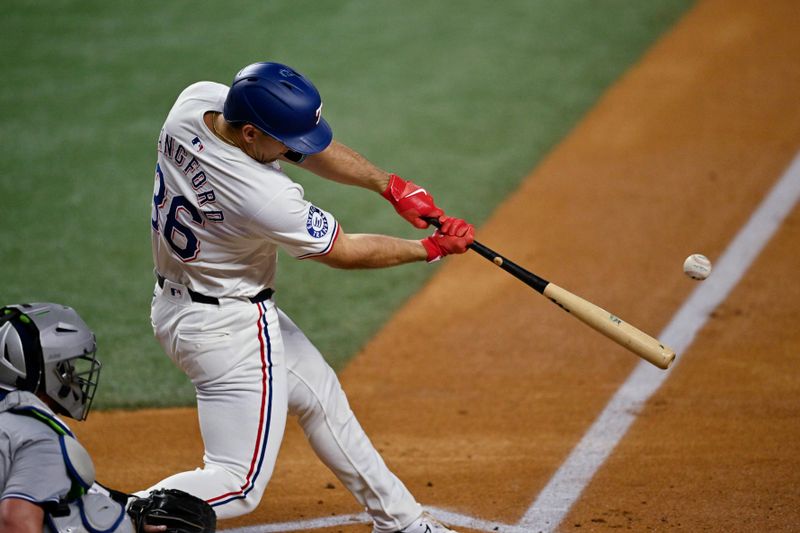 Sep 17, 2024; Arlington, Texas, USA; Texas Rangers left fielder Wyatt Langford (36) hits a ground run double against the Toronto Blue Jays during the first inning at Globe Life Field. Mandatory Credit: Jerome Miron-Imagn Images