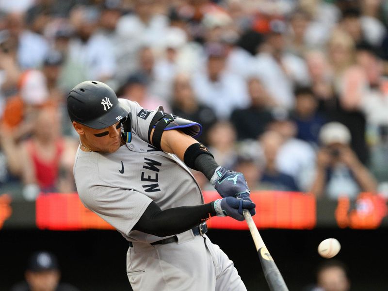 Apr 30, 2025; Baltimore, Maryland, USA; New York Yankees outfielder Aaron Judge (99) hits a home run during the first inning against the Baltimore Orioles at Oriole Park at Camden Yards. Mandatory Credit: Reggie Hildred-Imagn Images