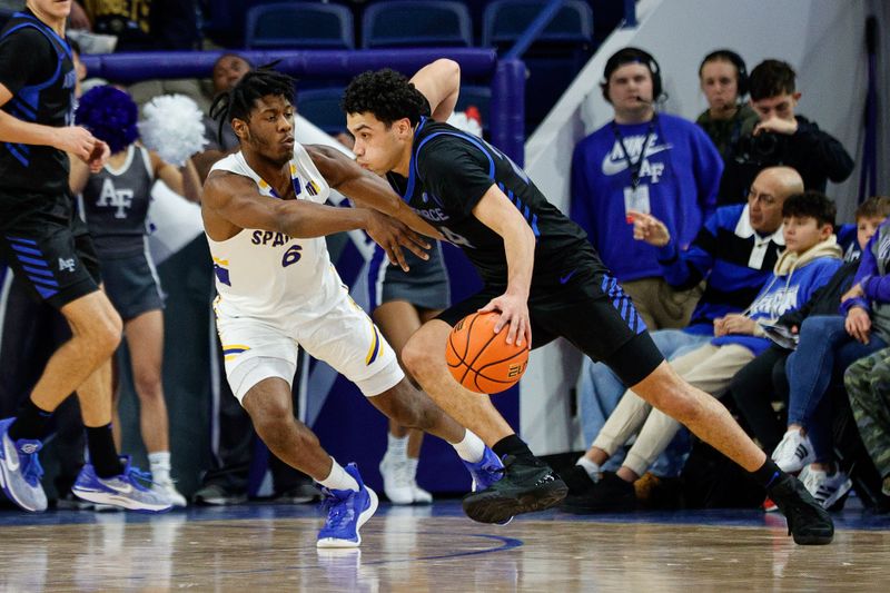 Jan 13, 2024; Colorado Springs, Colorado, USA; Air Force Falcons guard Jeffrey Mills (24) controls the ball against San Jose State Spartans guard Latrell Davis (6) in the first half at Clune Arena. Mandatory Credit: Isaiah J. Downing-USA TODAY Sports