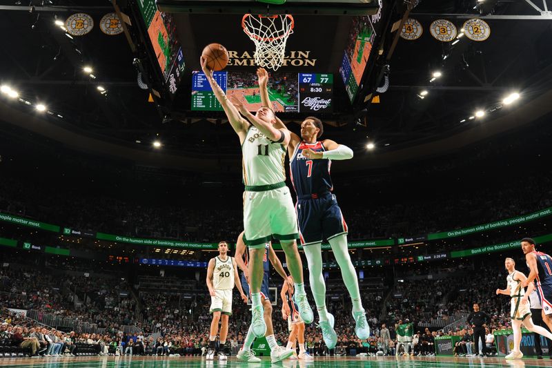 BOSTON, MA - APRIL 14: Payton Pritchard #11 of the Boston Celtics drives to the basket during the game  against the Washington Wizards on April 14, 2024 at the TD Garden in Boston, Massachusetts. NOTE TO USER: User expressly acknowledges and agrees that, by downloading and or using this photograph, User is consenting to the terms and conditions of the Getty Images License Agreement. Mandatory Copyright Notice: Copyright 2024 NBAE  (Photo by Brian Babineau/NBAE via Getty Images)