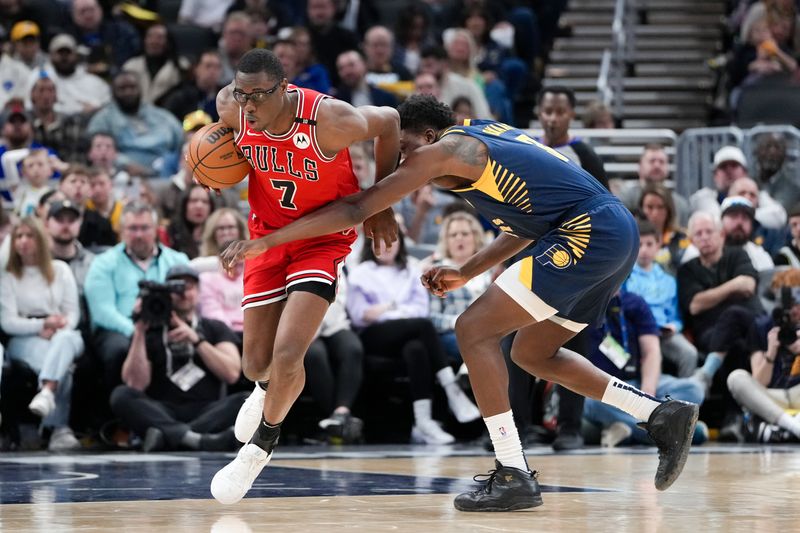 INDIANAPOLIS, INDIANA - MARCH 02: Jalen Smith #7 of the Chicago Bulls dribbles the ball while being guarded by Thomas Bryant #3 of the Indiana Pacers in the third quarter at Gainbridge Fieldhouse on March 02, 2025 in Indianapolis, Indiana. NOTE TO USER: User expressly acknowledges and agrees that, by downloading and or using this photograph, User is consenting to the terms and conditions of the Getty Images License Agreement. (Photo by Dylan Buell/Getty Images)