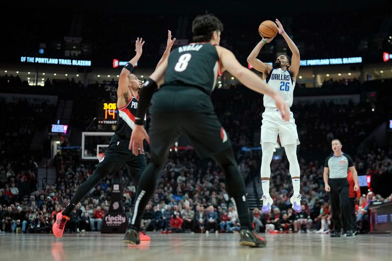 PORTLAND, OREGON - DECEMBER 01: Spencer Dinwiddie #26 of the Dallas Mavericks shoots the ball over Toumani Camara #33 of the Portland Trail Blazers during the first half at Moda Center on December 01, 2024 in Portland, Oregon. NOTE TO USER: User expressly acknowledges and agrees that, by downloading and or using this photograph, User is consenting to the terms and conditions of the Getty Images License Agreement. (Photo by Soobum Im/Getty Images)