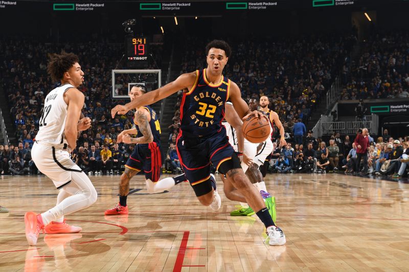 SAN FRANCISCO, CA - NOVEMBER 25: Trayce Jackson-Davis #32 of the Golden State Warriors handles the ball during the game against the Brooklyn Nets on November 25, 2024 at Chase Center in San Francisco, California. NOTE TO USER: User expressly acknowledges and agrees that, by downloading and or using this photograph, user is consenting to the terms and conditions of Getty Images License Agreement. Mandatory Copyright Notice: Copyright 2024 NBAE (Photo by Noah Graham/NBAE via Getty Images)