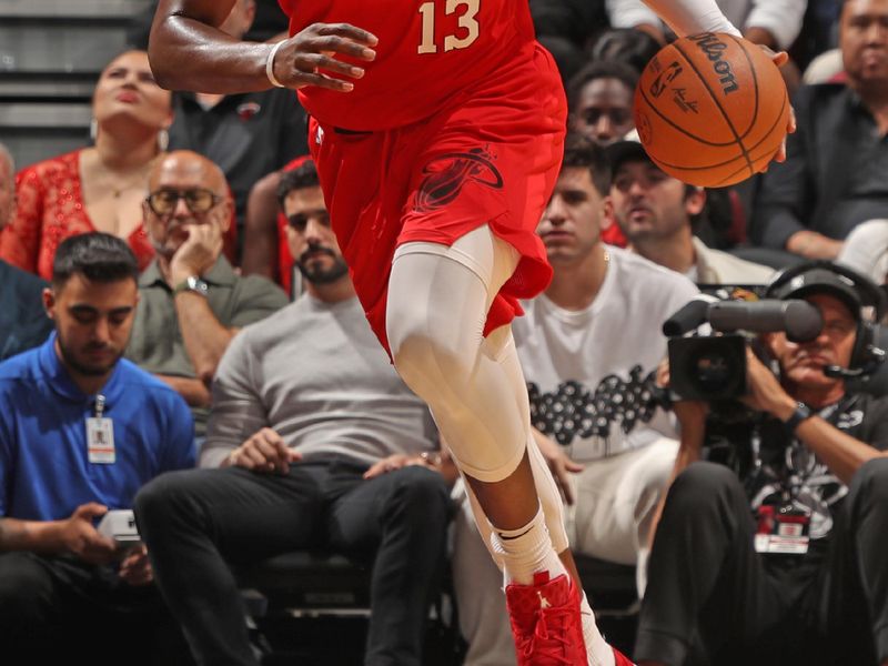 MIAMI, FL - NOVEMBER 18: Bam Adebayo #13 of the Miami Heat dribbles the ball during the game against the Philadelphia 76ers on November 18, 2024 at Kaseya Center in Miami, Florida. NOTE TO USER: User expressly acknowledges and agrees that, by downloading and or using this Photograph, user is consenting to the terms and conditions of the Getty Images License Agreement. Mandatory Copyright Notice: Copyright 2024 NBAE (Photo by Issac Baldizon/NBAE via Getty Images)