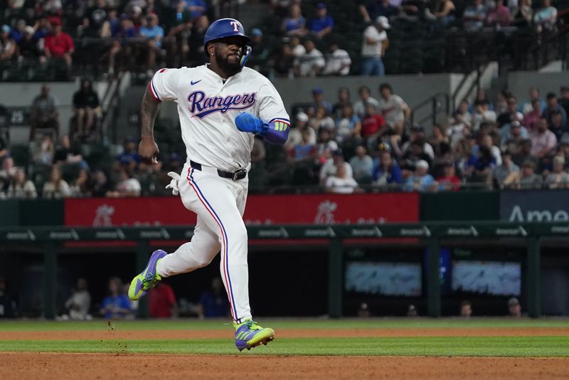 May 13, 2025; Arlington, Texas, USA; Texas Rangers outfielder Adolis García (53) runs to third base as he tags up during the eighth inning against the Colorado Rockies at Globe Life Field. Mandatory Credit: Raymond Carlin III-Imagn Images