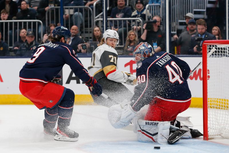 Mar 4, 2024; Columbus, Ohio, USA; Columbus Blue Jackets goalie Daniil Tarasov (40) stops the shot attempt of Vegas Golden Knights center William Karlsson (71) during the first period at Nationwide Arena. Mandatory Credit: Russell LaBounty-USA TODAY Sports