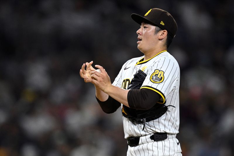 Jul 6, 2024; San Diego, California, USA; San Diego Padres relief pitcher Yuki Matsui (1) prepares to pitch against the Arizona Diamondbacks during the seventh inning at Petco Park. Mandatory Credit: Orlando Ramirez-USA TODAY Sports