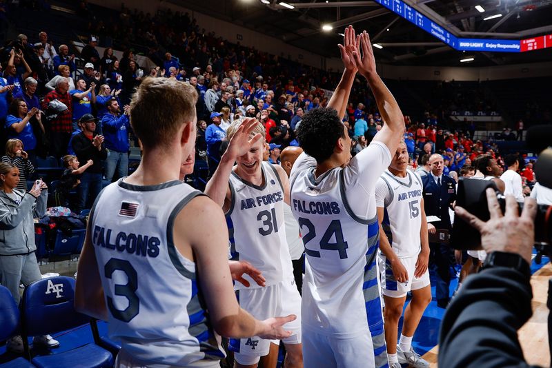 Feb 10, 2023; Colorado Springs, Colorado, USA; Air Force Falcons forward Rytis Petraitis (31) and guard Jeffrey Mills (24) and guard Jake Heidbreder (3) celebrate after the game against the New Mexico Lobos at Clune Arena. Mandatory Credit: Isaiah J. Downing-USA TODAY Sports