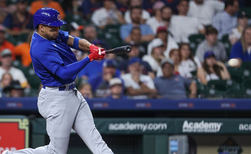 May 17, 2023; Houston, Texas, USA; Chicago Cubs center fielder Christopher Morel (5) hits a single during the ninth inning against the Houston Astros at Minute Maid Park. Mandatory Credit: Troy Taormina-USA TODAY Sports