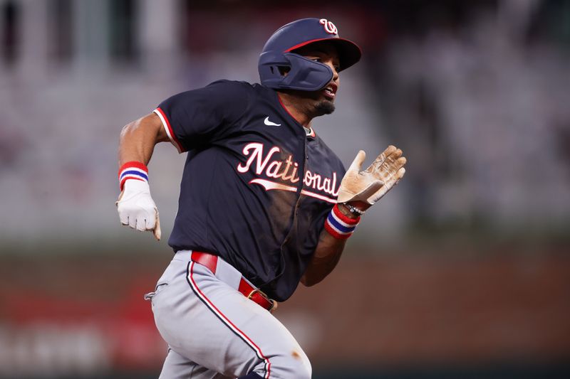 May 14, 2025; Atlanta, Georgia, USA; Washington Nationals shortstop Nasim Nunez (26) rounds third base against the Atlanta Braves in the eighth inning at Truist Park. Mandatory Credit: Brett Davis-Imagn Images