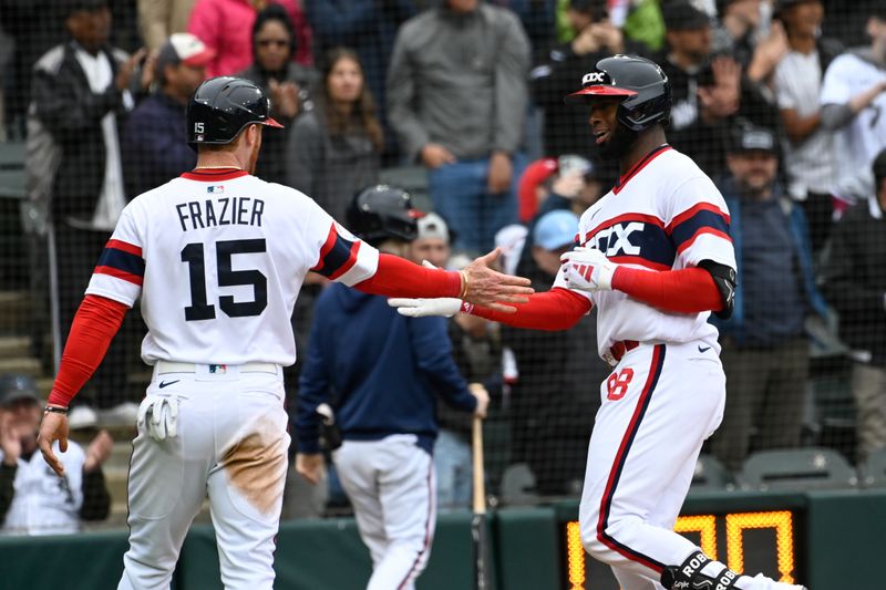 Jun 11, 2023; Chicago, Illinois, USA;  Chicago White Sox center fielder Luis Robert Jr. (88) celebrates with Chicago White Sox right fielder Clint Frazier (15) after they score on his two-run home run against the Miami Marlins during the seventh inning at Guaranteed Rate Field. Mandatory Credit: Matt Marton-USA TODAY Sports