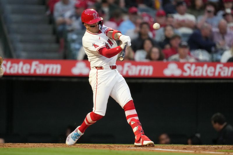Apr 30, 2024; Anaheim, California, USA; Los Angeles Angels shortstop Zach Neto (9) hits a home run in the third inning against the Philadelphia Phillies at Angel Stadium. Mandatory Credit: Kirby Lee-USA TODAY Sports