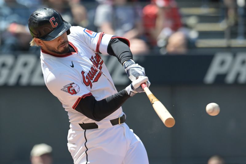 Apr 23, 2025; Cleveland, Ohio, USA; Cleveland Guardians second baseman Gabriel Arias (13) hits a double during the first inning against the New York Yankees at Progressive Field. Mandatory Credit: Ken Blaze-Imagn Images