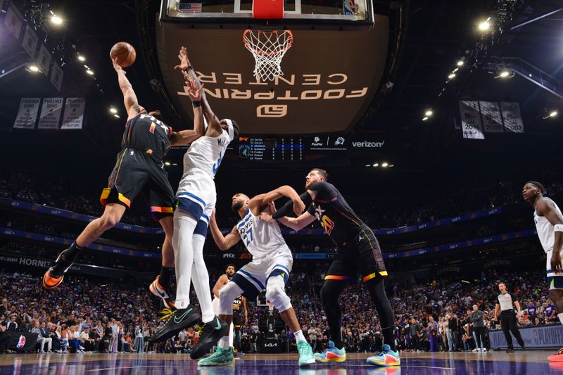 PHOENIX, AZ - APRIL 26:  Devin Booker #1 of the Phoenix Suns drives to the basket during the game against the Minnesota Timberwolves during Round 1 Game 3 of the 2024 NBA Playoffs on April 26, 2024 at Footprint Center in Phoenix, Arizona. NOTE TO USER: User expressly acknowledges and agrees that, by downloading and or using this photograph, user is consenting to the terms and conditions of the Getty Images License Agreement. Mandatory Copyright Notice: Copyright 2024 NBAE (Photo by Barry Gossage/NBAE via Getty Images)