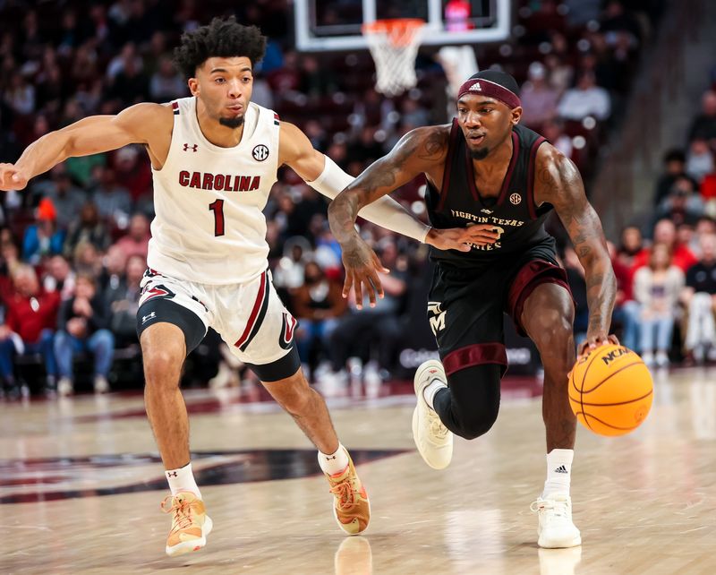 Jan 14, 2023; Columbia, South Carolina, USA; Texas A&M Aggies guard Tyrece Radford (23) drives around South Carolina Gamecocks guard Jacobi Wright (1) in the second half at Colonial Life Arena. Mandatory Credit: Jeff Blake-USA TODAY Sports