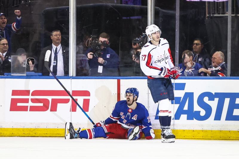 Apr 21, 2024; New York, New York, USA; New York Rangers left wing Chris Kreider (20) celebrates after scoring a goal next to Washington Capitals defenseman Trevor van Riemsdyk (57) in the third period in game one of the first round of the 2024 Stanley Cup Playoffs at Madison Square Garden. Mandatory Credit: Wendell Cruz-USA TODAY Sports