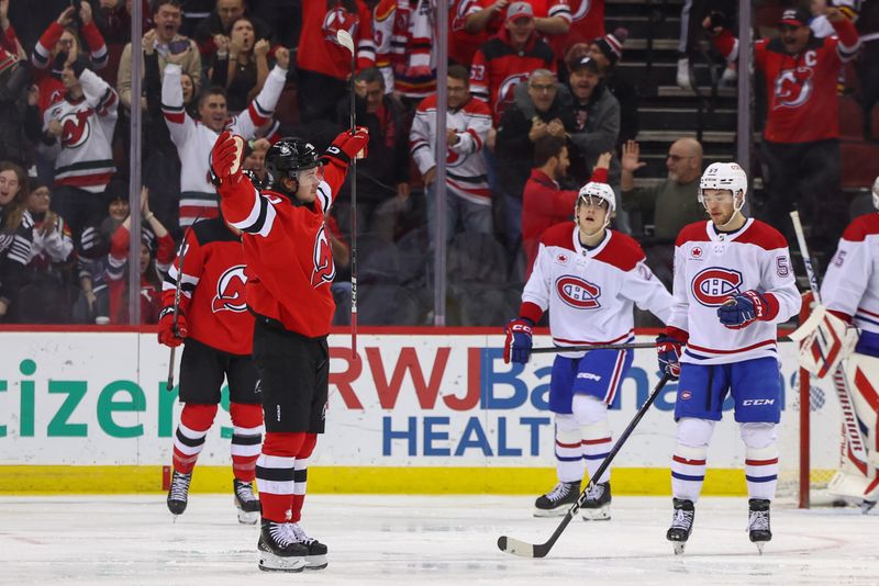 Jan 17, 2024; Newark, New Jersey, USA; New Jersey Devils right wing Alexander Holtz (10) celebrates his goal against the Montreal Canadiens during the third period at Prudential Center. Mandatory Credit: Ed Mulholland-USA TODAY Sports