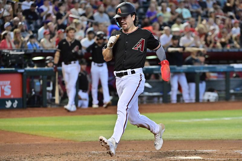 Jul 26, 2023; Phoenix, Arizona, USA;  Arizona Diamondbacks left fielder Corbin Carroll (7) scores in the third inning against the St. Louis Cardinals at Chase Field. Mandatory Credit: Matt Kartozian-USA TODAY Sports