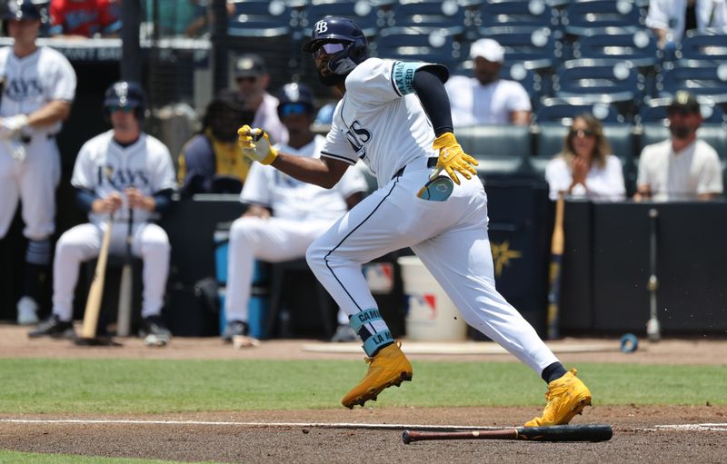 Jun 6, 2025; St. Petersburg, Florida, USA; Tampa Bay Rays third base Junior Caminero (13) doubles during the first inning against the Miami Marlins  at George M. Steinbrenner Field. Mandatory Credit: Kim Klement Neitzel-Imagn Images