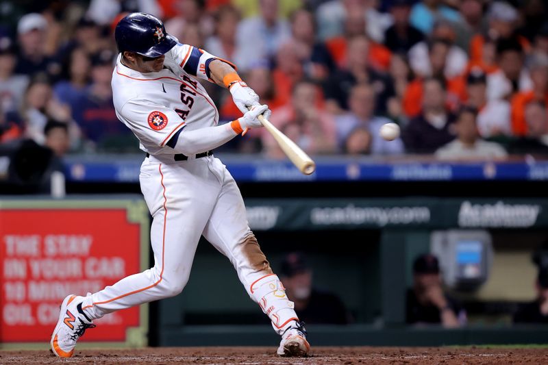 Apr 30, 2024; Houston, Texas, USA; Houston Astros shortstop Jeremy Pena (3) hits a single against the Cleveland Guardians during the fifth inning at Minute Maid Park. Mandatory Credit: Erik Williams-USA TODAY Sports