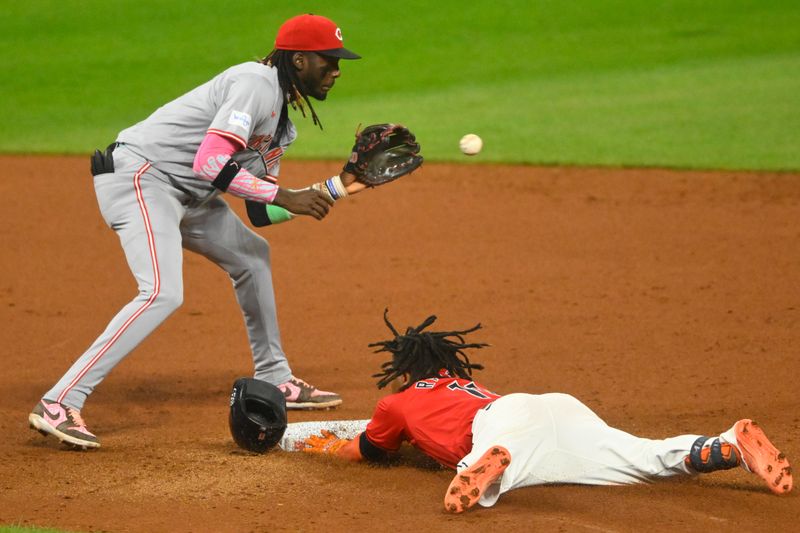 Sep 25, 2024; Cleveland, Ohio, USA; Cleveland Guardians third baseman Jose Ramirez (11) slides to second base with a double beside Cincinnati Reds shortstop Elly De La Cruz (44) in the sixth inning at Progressive Field. Mandatory Credit: David Richard-Imagn Images