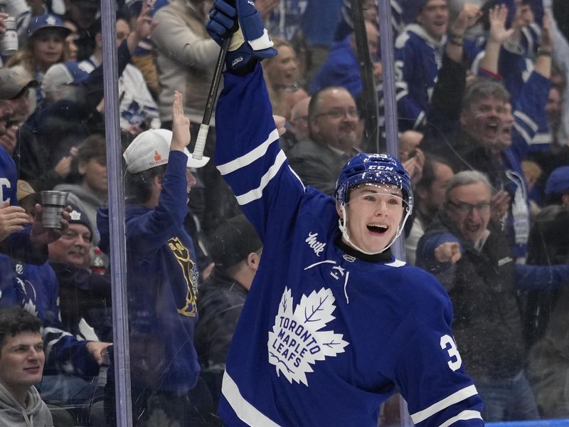 Nov 20, 2024; Toronto, Ontario, CAN; Toronto Maple Leafs forward Fraser Minten (39) reacts after scoring his first career NHL goal against the Vegas Golden Knights during the first period at Scotiabank Arena. Mandatory Credit: John E. Sokolowski-Imagn Images