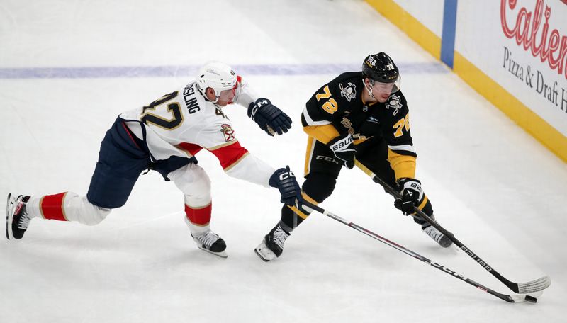 Dec 3, 2024; Pittsburgh, Pennsylvania, USA;  Pittsburgh Penguins left wing Anthony Beauvillier (72) moves the puck against Florida Panthers defenseman Gustav Forsling (42) during the first period at PPG Paints Arena. Mandatory Credit: Charles LeClaire-Imagn Images