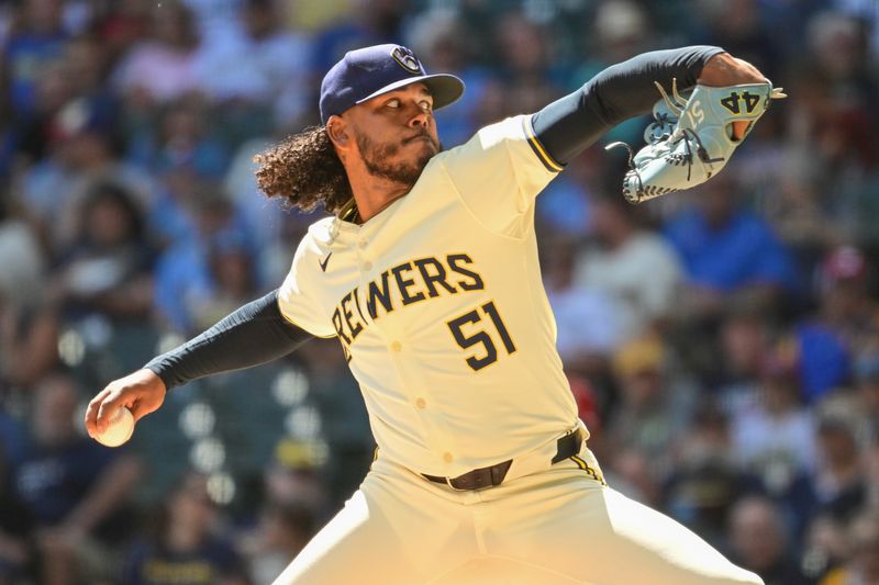 Sep 2, 2024; Milwaukee, Wisconsin, USA; Milwaukee Brewers starting pitcher Freddy Peralta (51) pitches in the first inning against the St. Louis Cardinals at American Family Field. Mandatory Credit: Benny Sieu-USA TODAY Sports