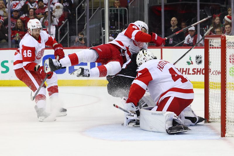 Dec 23, 2023; Newark, New Jersey, USA; Detroit Red Wings defenseman Ben Chiarot (8) hits New Jersey Devils left wing Jesper Bratt (63) during the second period at Prudential Center. Mandatory Credit: Ed Mulholland-USA TODAY Sports