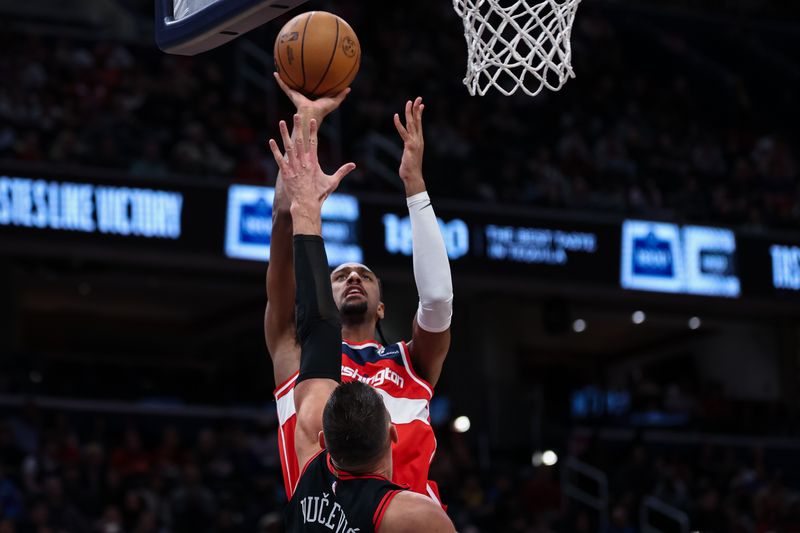 WASHINGTON, DC - JANUARY 01: Alexandre Sarr #20 of the Washington Wizards shoots the ball over Nikola Vucevic #9 of the Chicago Bulls during the second half at Capital One Arena on January 1, 2025 in Washington, DC. NOTE TO USER: User expressly acknowledges and agrees that, by downloading and or using this photograph, User is consenting to the terms and conditions of the Getty Images License Agreement. (Photo by Scott Taetsch/Getty Images)