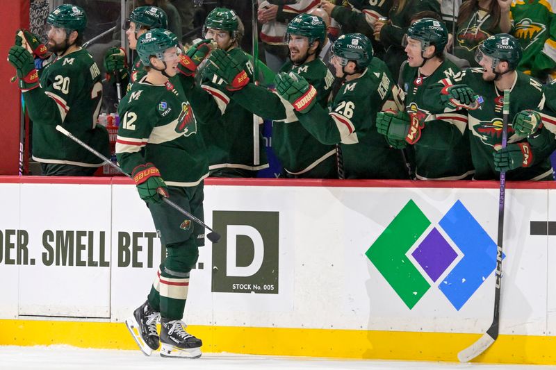 Jan 12, 2024; Saint Paul, Minnesota, USA; Minnesota Wild forward Matt Boldy (12) celebrates his goal against the Philadelphia Flyers during the third period at Xcel Energy Center. Mandatory Credit: Nick Wosika-USA TODAY Sports