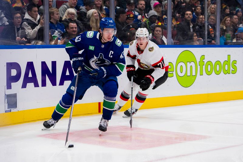 Jan 2, 2024; Vancouver, British Columbia, CAN; Ottawa Senators forward Ridly Greig (71) pursues Vancouver Canucks defenseman Quinn Hughes (43) in the second period at Rogers Arena. Mandatory Credit: Bob Frid-USA TODAY Sports