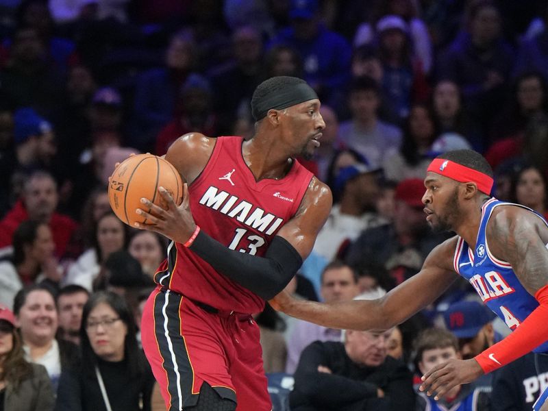 PHILADELPHIA, PA - FEBRUARY 14: Bam Adebayo #13 of the Miami Heat looks to pass the ball during the game against the Philadelphia 76ers on February 14, 2024 at the Wells Fargo Center in Philadelphia, Pennsylvania NOTE TO USER: User expressly acknowledges and agrees that, by downloading and/or using this Photograph, user is consenting to the terms and conditions of the Getty Images License Agreement. Mandatory Copyright Notice: Copyright 2024 NBAE (Photo by Jesse D. Garrabrant/NBAE via Getty Images)