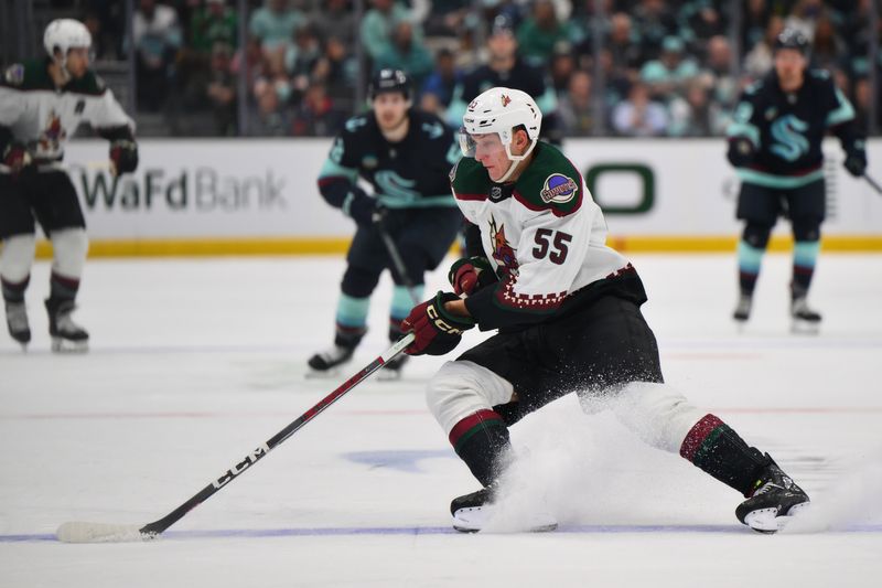 Apr 9, 2024; Seattle, Washington, USA; Arizona Coyotes defenseman Maksymilian Szuber (55) plays the puck during the second period against the Seattle Kraken at Climate Pledge Arena. Mandatory Credit: Steven Bisig-USA TODAY Sports