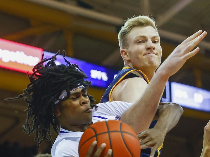 Jan 14, 2023; Seattle, Washington, USA; Washington Huskies guard Keyon Menifield (23) collects a rebound against California Golden Bears forward Lars Thiemann (right) during the first half at Alaska Airlines Arena at Hec Edmundson Pavilion. Mandatory Credit: Joe Nicholson-USA TODAY Sports