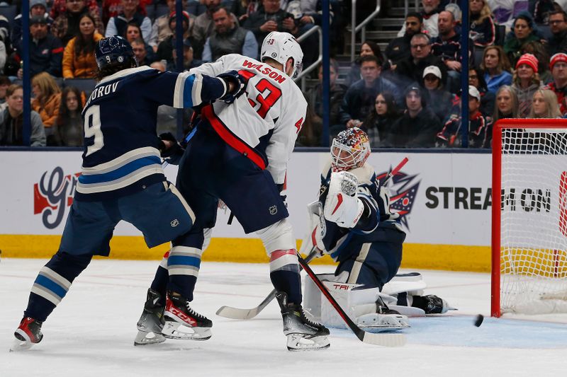 Dec 21, 2023; Columbus, Ohio, USA; Washington Capitals right wing Tom Wilson (43) tips the [puck wide of the net against the Columbus Blue Jackets during the second period at Nationwide Arena. Mandatory Credit: Russell LaBounty-USA TODAY Sports