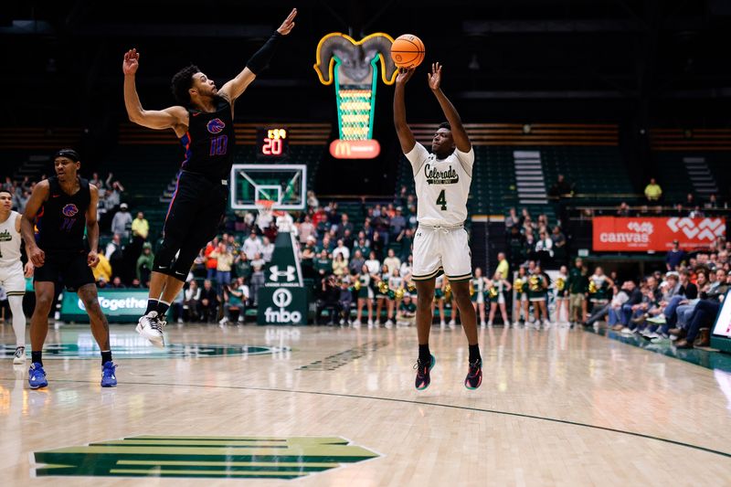 Feb 15, 2023; Fort Collins, Colorado, USA; Colorado State Rams guard Isaiah Stevens (4) attempts a shot as Boise State Broncos guard Marcus Shaver Jr. (10) defends in the second half at Moby Arena. Mandatory Credit: Isaiah J. Downing-USA TODAY Sports