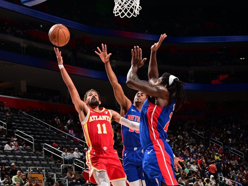 DETROIT, MI - NOVEMBER 8: Trae Young #11 of the Atlanta Hawks shoots the ball during the game against the Detroit Pistons on November  8, 2024 at Little Caesars Arena in Detroit, Michigan. NOTE TO USER: User expressly acknowledges and agrees that, by downloading and/or using this photograph, User is consenting to the terms and conditions of the Getty Images License Agreement. Mandatory Copyright Notice: Copyright 2024 NBAE (Photo by Chris Schwegler/NBAE via Getty Images)