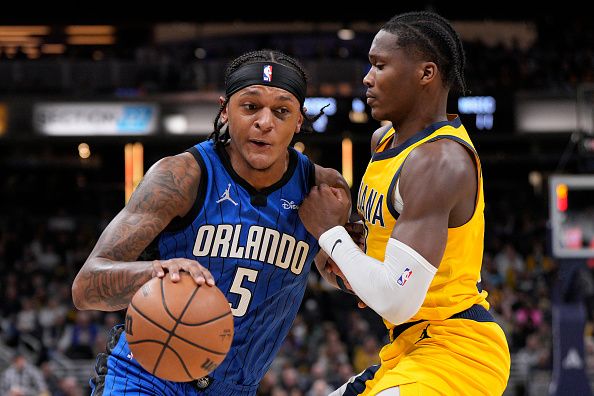 INDIANAPOLIS, INDIANA - NOVEMBER 19: Paolo Banchero #5 of the Orlando Magic drives against Bennedict Mathurin #00 of the Indiana Pacers during the first half of an NBA game at Gainbridge Fieldhouse on November 19, 2023 in Indianapolis, Indiana. NOTE TO USER: User expressly acknowledges and agrees that, by downloading and or using this photograph, User is consenting to the terms and conditions of the Getty Images License Agreement. (Photo by Jeff Dean/Getty Images)