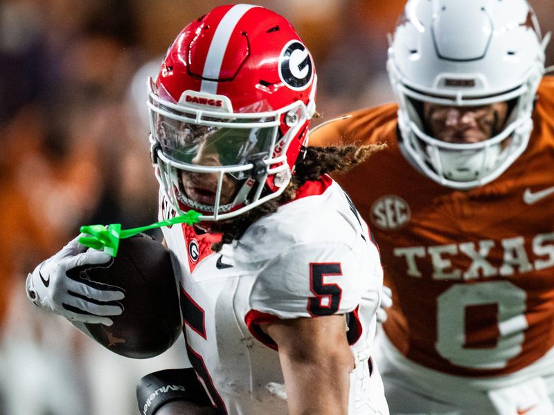 Oct 19, 2024; Austin, Texas, USA; Georgia Bulldogs wide receiver Anthony Evans III (5) carries the ball against the Texas Longhorns in the third quarter at Darrell K. Royal Texas Memorial Stadium. Mandatory Credit: Sara Diggins/USA TODAY Network via Imagn Images