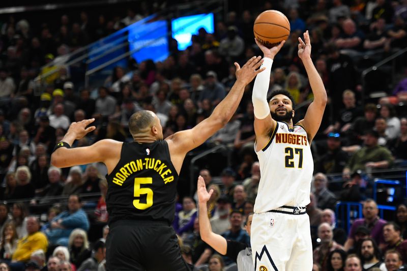 SALT LAKE CITY, UTAH - APRIL 09: Jamal Murray #27 of the Denver Nuggets shoots over Talen Horton-Tucker #5 of the Utah Jazz during the second half at Delta Center on April 09, 2024 in Salt Lake City, Utah. NOTE TO USER: User expressly acknowledges and agrees that, by downloading and or using this photograph, User is consenting to the terms and conditions of the Getty Images License Agreement.  (Photo by Alex Goodlett/Getty Images)