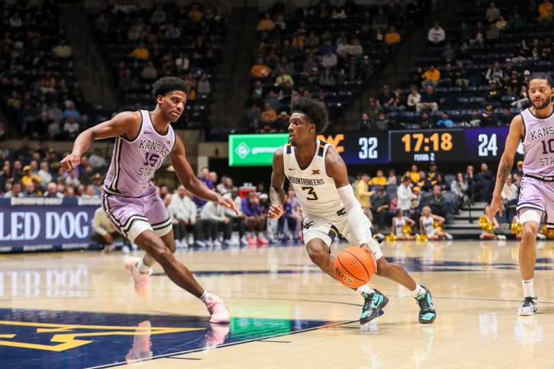 Jan 27, 2026; Morgantown, West Virginia, USA; West Virginia Mountaineers guard Honor Huff (3) drives down the lane against Kansas State Wildcats forward Taj Manning (15) during the second half at Hope Coliseum. Mandatory Credit: Ben Queen-Imagn Imagesa