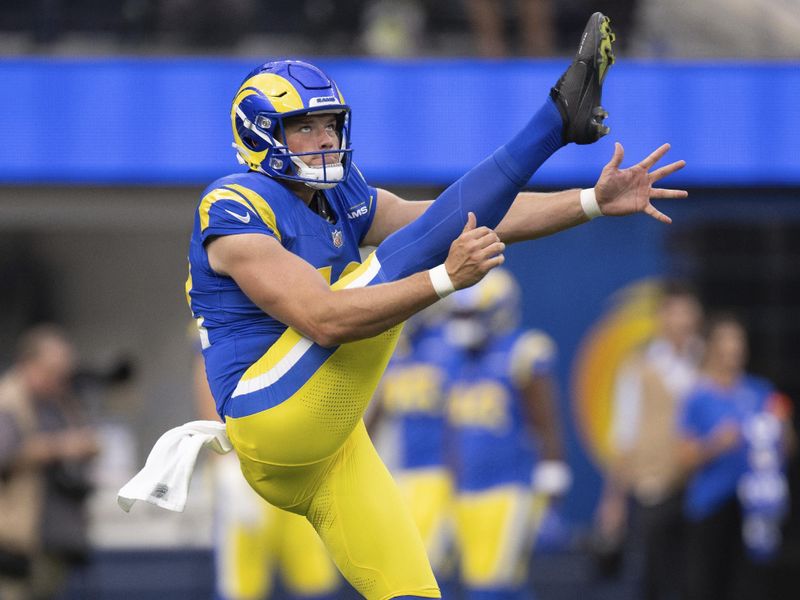 Los Angeles Rams punter Ethan Evans (42) punts before an NFL preseason football game against the Las Vegas Raiders, Saturday, Aug. 19, 2023, in Inglewood, Calif. (AP Photo/Kyusung Gong)