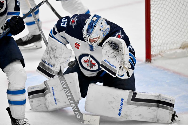 Apr 11, 2024; Dallas, Texas, USA; Winnipeg Jets goaltender Laurent Brossoit (39) makes a glove save on a Dallas Stars shot during the second period at the American Airlines Center. Mandatory Credit: Jerome Miron-USA TODAY Sports