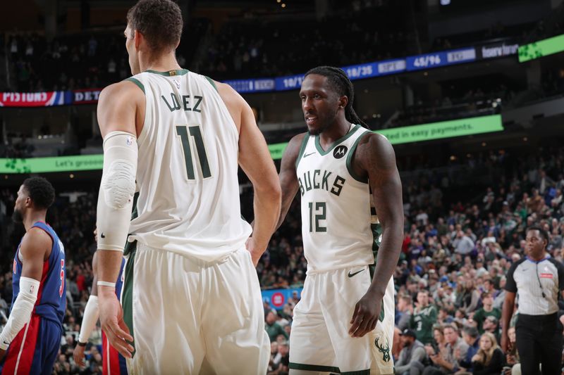 MILWAUKEE, WI - NOVEMBER 13: Brook Lopez #11 and Taurean Prince #12 of the Milwaukee Bucks high five during the game against the Detroit Pistons on November 13, 2024 at the Fiserv Forum Center in Milwaukee, Wisconsin. NOTE TO USER: User expressly acknowledges and agrees that, by downloading and or using this Photograph, user is consenting to the terms and conditions of the Getty Images License Agreement. Mandatory Copyright Notice: Copyright 2024 NBAE (Photo by Gary Dineen/NBAE via Getty Images).